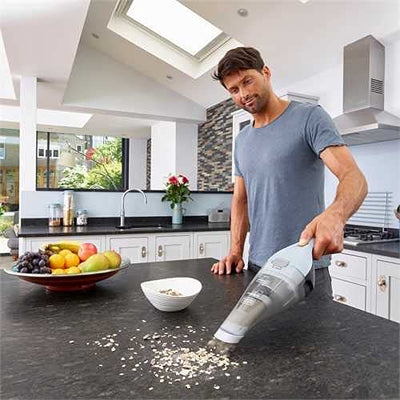 BLACK+DECKER Handstaubsauger Akku 7,2V Dustbuster (Handsauger beutellos + kabellos, breite Saugöffnung, spülmaschinenfester Staubfangbehälter inkl. Fugendüse & Ladestation mit Wandhalterung) NVC215W