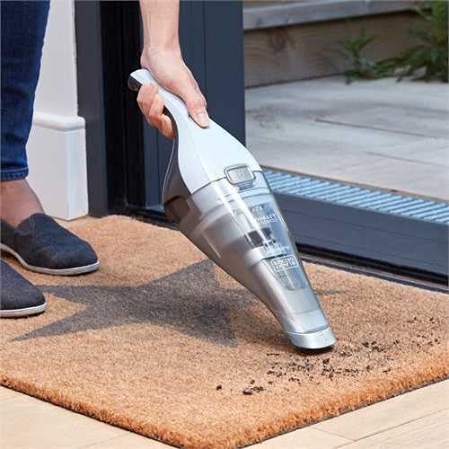 BLACK+DECKER Handstaubsauger Akku 7,2V Dustbuster (Handsauger beutellos + kabellos, breite Saugöffnung, spülmaschinenfester Staubfangbehälter inkl. Fugendüse & Ladestation mit Wandhalterung) NVC215W