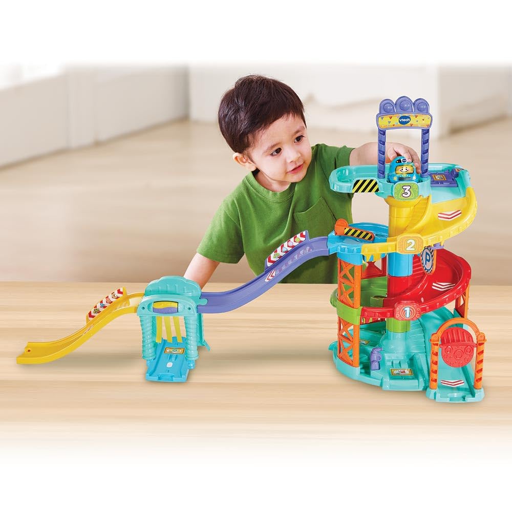 VTech Baby Tut Tut Baby Flitzer - Parkhaus – Interaktive Parkgarage mit beweglichen Elementen, Melodien, Liedern und mehrsprachigem Tut Tut Baby Flitzer Bus – Für Kinder von 1-5 Jahren
