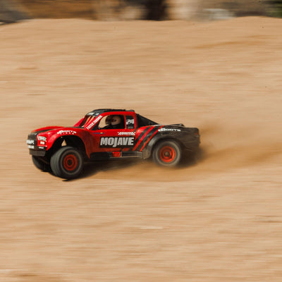 ARRMA Mojave Grom Ferngesteuertes Auto, RC Auto 1/18, Brushless Motor über 30 km/h, inkl. Akku und Zubehör, Rot-Schwarz, ARA2104T1