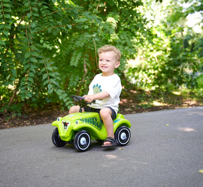 Big Bobby Car Classic Dino - Rutschauto ab 1 Jahr im bunten Dino-Design mit schwarzem Sicherheits-Lenkrad und Hupe, für Kinder ab 12 Monaten (bis 50 kg), grün mit Aufklebern
